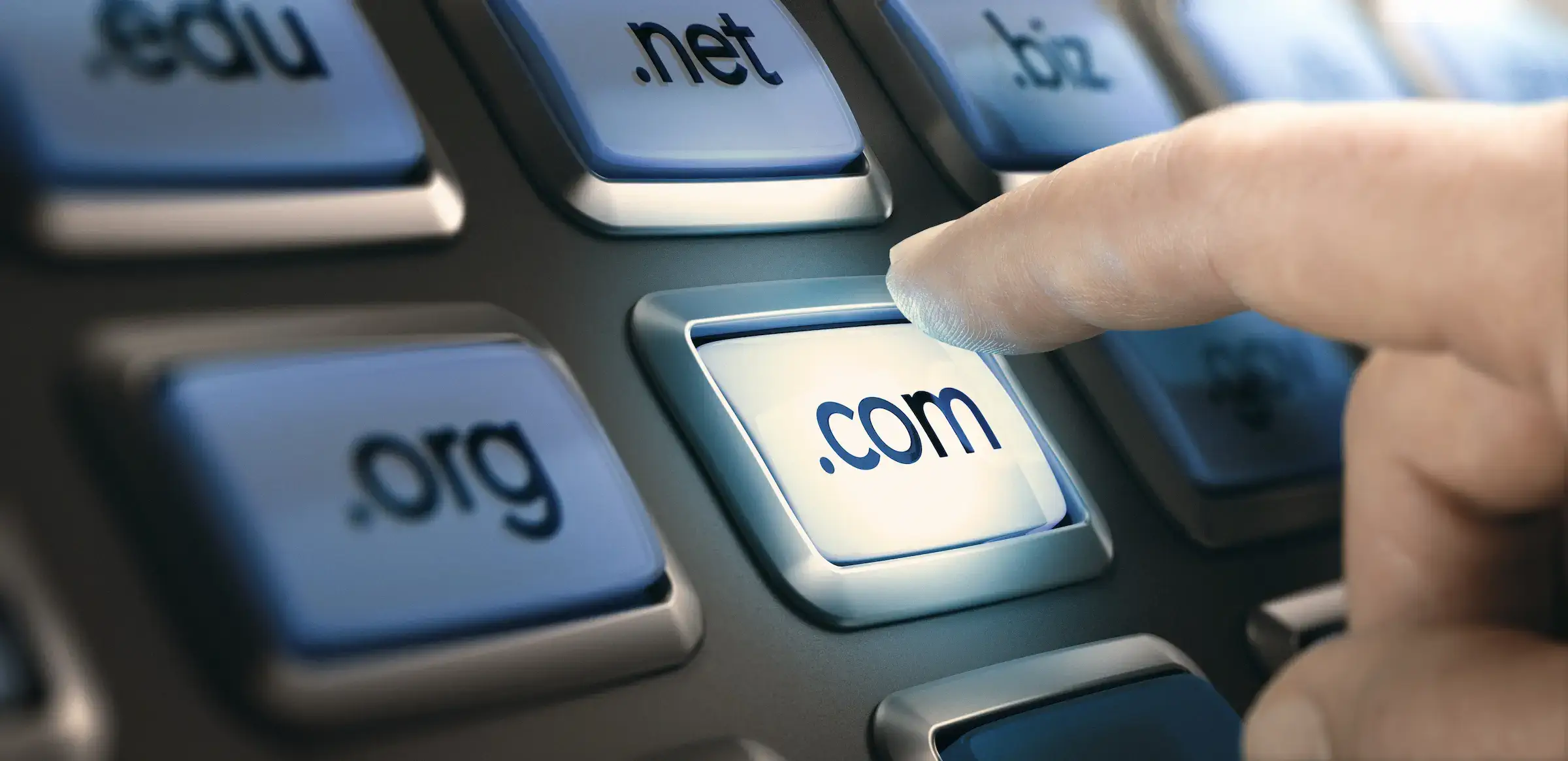 A finger pressing a button symbolizing the choosing of a domain
